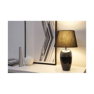 lampe Pauleen Midnight Beauty noire et argent posée sur un meuble